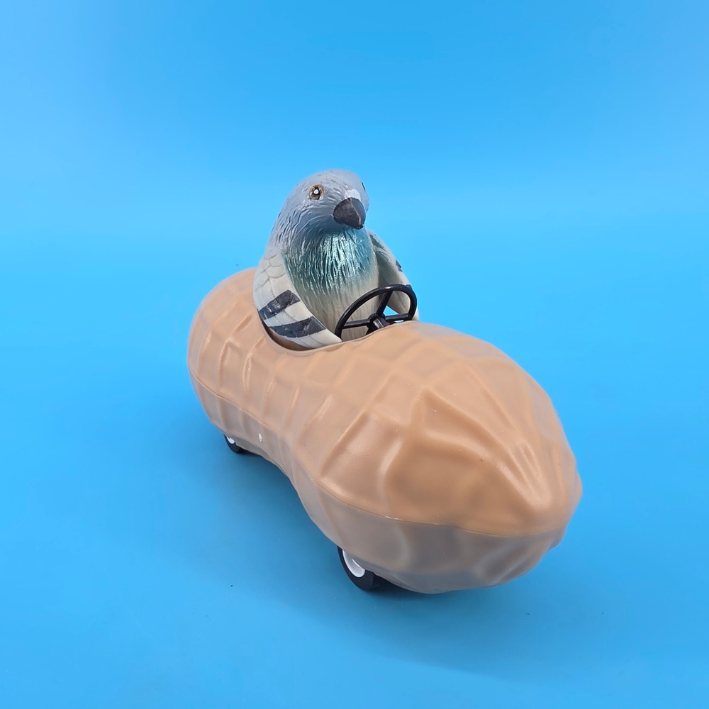 Archie McPhee Racing Pigeon in a Peanut Pull Back Toy Novelty Collectible